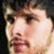 A four- shows a person's face with subtle expression changes , featuring dark hair and light skin against a black background