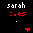 Black background with pixelated text reading 'sarah' in white, 'loves' in red, and 'jr' in white below it, plus a small red heart symbol.
