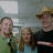 A static image with a photo of three people on the left and green pixelated text on a black background on the right, expressing affection for cousins named Weston and Hershel.