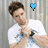 A pixelated image of a person in a white shirt with hands clasped, next to blue text reading "Gokey all the way babe" on black background.