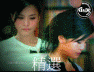 Animated sequence of a woman with dark hair in traditional updo, wearing white and black clothing, interacting with other figures against bookshelf and indoor backgrounds.