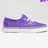 A purple sneaker with white sole on light gray background, adjacent to vertical rainbow color gradient.