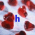 Red heart shapes on a light background with changing text: 'h', 'hi', and 'him' in blue, red, and green respectively.