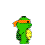 Green pixelated character with orange checkered bandana, yellow circular object on right side, dark green accents, and a single visible eye.
