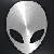 Pixelated grayscale alien head with large black eyes and smooth rounded features against a dark background.