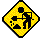 Yellow diamond-shaped icon with black construction worker silhouette holding a shovel, surrounded by small dark shapes resembling rocks or debris.
