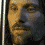 A pixelated face with long hair and a mustache appears in multiple views showing slight shifts in angle and lighting across frames.