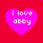 Four pink hearts on a red background with white text reading "i love abby" in pixelated font.
