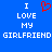 Blue background with white pixelated text reading "I LOVE MY GIRLFRIEND" and a red pixelated heart symbol replacing the word "LOVE" in the left section.