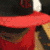 A split-screen image with a red and black hat on the top-left, a blue star and 'COWBOYS' text on the top-right, and a grayscale face on the bottom-left.