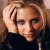 A pixelated image of a person with light brown hair resting their head on one hand, next to green text reading 'Original Icons .com' in bright green letters.