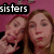 Two pixelated figures with light brown hair appear against a pink background, one figure partially overlapping the other; white text reads 'sisters' on black bar.