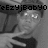 Pixelated grayscale image of a person with short hair, wearing a dark top, holding a light-colored object, with overlaid text at the top.