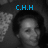 A grayscale image of a person with dark hair, featuring blue text overlays reading "C.H.H" and "I Love You" in the top-left and bottom-left sections.