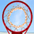 A circular red frame encloses a light blue background with a faint, blurred beige ring inside, set against a pale blue sky-like backdrop.