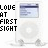 identical white iPod-like devices with circular click wheels, each displaying 'LOVE AT FIRST SIGHT' text where the word 'FIRST' cycles through black and cyan colors