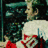 Pixelated image of a person in a white and red outfit with green foliage background, split into four quadrants with red and gray sections containing text.