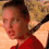 A person in a red top appears in four showing head movement from left to right against a blurred background