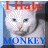 A 2x2 contact sheet of four animated frames showing a white cat with pixelated eyes and nose, each frame displaying the text "I Hate" in red above and "MONKEY" in different colors below against a light blue background.
