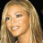 A 48x48 pixel buddy icon split into two sections: a left-side portrait of a person with long blonde hair and right-side green text on dark background.