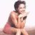 Pixelated image of a person in a crouched pose holding an object, next to green text reading 'Original Icons .com' on dark background.