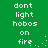 Green background with white pixelated text reading 'dont light hobos on fire' and small white dots forming a trailing effect.