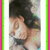 A pixelated image of a person with dark hair in a black top, framed by green and pink borders on the left side.