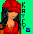Pixelated image of a woman with long dark hair wearing red clothing and a large red headwrap, standing against a green checkered background with vertical text reading KATTEY.