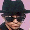 Six distinct headshots of men with sunglasses against a pink background, arranged in a with one empty