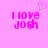 Pixelated pink text "I love Josh" on a solid pink background with a small heart symbol above the text.