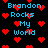 Pixelated blue text reads "Brandon Rocks My World" over a black background with scattered red heart shapes.