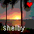 Pixelated sunset scene with trees, water reflection, red heart symbol, and white text 'shelby' at bottom.