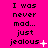 A bright pink background displays repeated text "I was never mad... just jealous" with varying punctuation and small symbols next to the word "jealous."