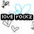 Pixelated icon with black text blocks reading 'LOVE' and 'ROCKZ', surrounded by light blue heart outlines and gray pixelated hearts on white background.