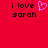 Red background with black text 'i love sarah' and a pink pixelated heart symbol on the left side.