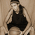 A person in a black tank top and headband holds a basketball, with subtle pose variations across frames.