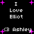 Black background with white pixelated text and pink starbursts; repeated phrases "I Love Elliot" and "<3 Ashley" appear in multiple
