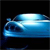 Pixelated blue vehicle with white highlights on a black background, appearing as a stylized car or boat with a rounded front and visible headlights.