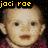 Pixelated image of a baby with light skin and brown eyes, wearing a maroon top against black background.