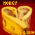 Animated contact sheet of a yellow cheese-shaped icon with "HONEY" and "LOVE" text on red background, showing frame-by-frame animation changes.