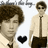 Pixelated image of a person in light shirt and dark tie with brown hair, featuring black heart symbol and repeated text above.