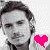 A 2-frame contact sheet of a grayscale portrait with a pink heart animation, showing the heart's fill changing from solid to outline between frames.