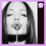 A black-and-white portrait of a woman with long hair, lips pursed in a kiss, against a light background. A vertical dark purple bar on the right contains changing pink text and symbols.