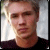 Pixelated image of a person with light hair wearing dark clothing, next to pink text reading 'chad is a hottie' on black background.