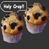 Six blueberry muffins in white paper liners with speech bubbles containing text, arranged in two on a dark gray background