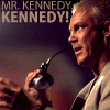 A static image shows a man holding a microphone with text reading "MR. KENNEDY KENNEDY!" above him.