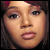 Pixelated close-up of a person's face with brown hair and light skin tone, displayed as a static buddy icon.