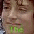 A four- shows a person's face with text overlays: 'The' in green, 'Green' in yellow, and 'Dragon' in black