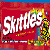 Animated image shows Skittles candy box, ampersand symbol, and fried chicken pieces on red and gray background.