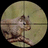A circular pixelated image shows a light brown and white animal with dark eyes, positioned against a muted greenish-yellow background.